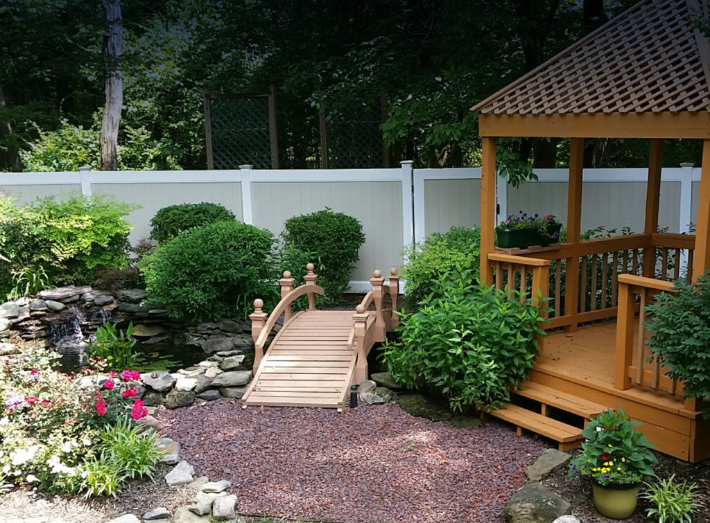 Tan and White Vinyl Privacy Fence