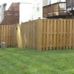 Wood Board on Board Fence in Backyard