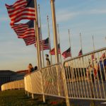 Barricade Fence Near Flag Poles