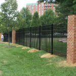 Large Masonry Columns and Iron Fence