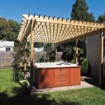 Bathtub under Wood Pergola