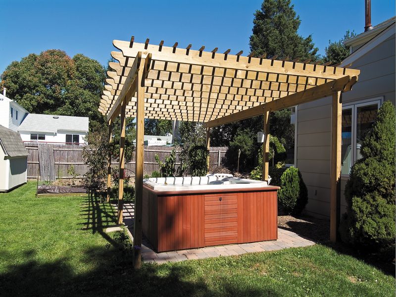 Bathtub under Wood Pergola