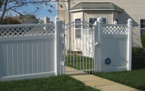 Vinyl Privacy Fence and Iron Gate