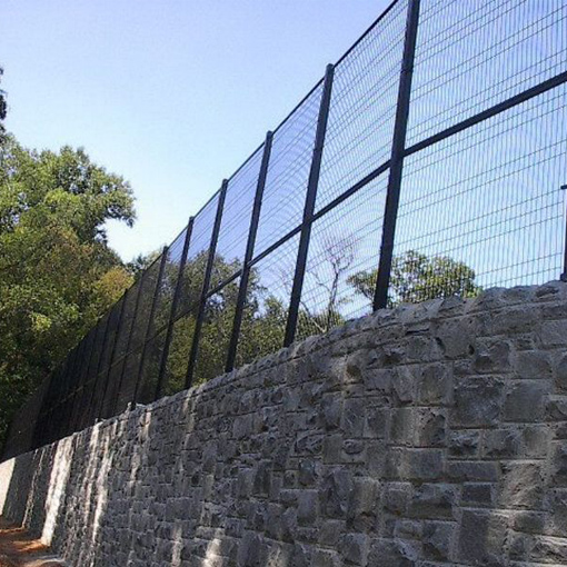 Welded Wire Fence on Stone Wall