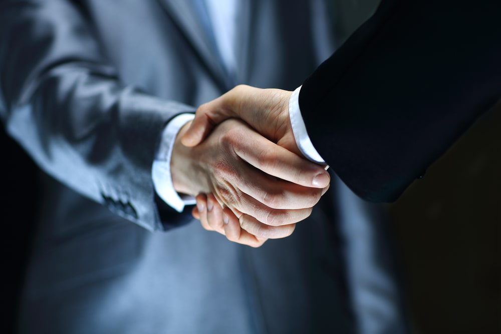 Two businessmen shaking hands