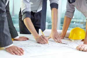 A team works on a fence installation plan.