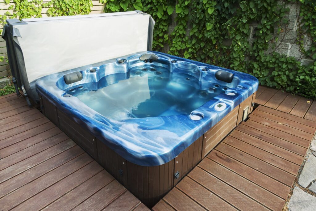 A deck with a hot tub